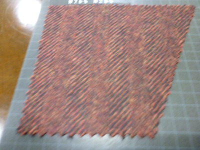 エンジ系の色合いのフラノでチェスターコート